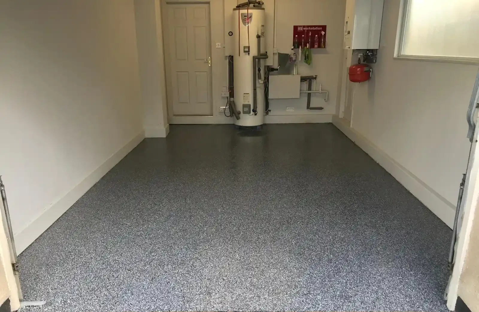 Epoxy resin garage floor with a PVC flake finish